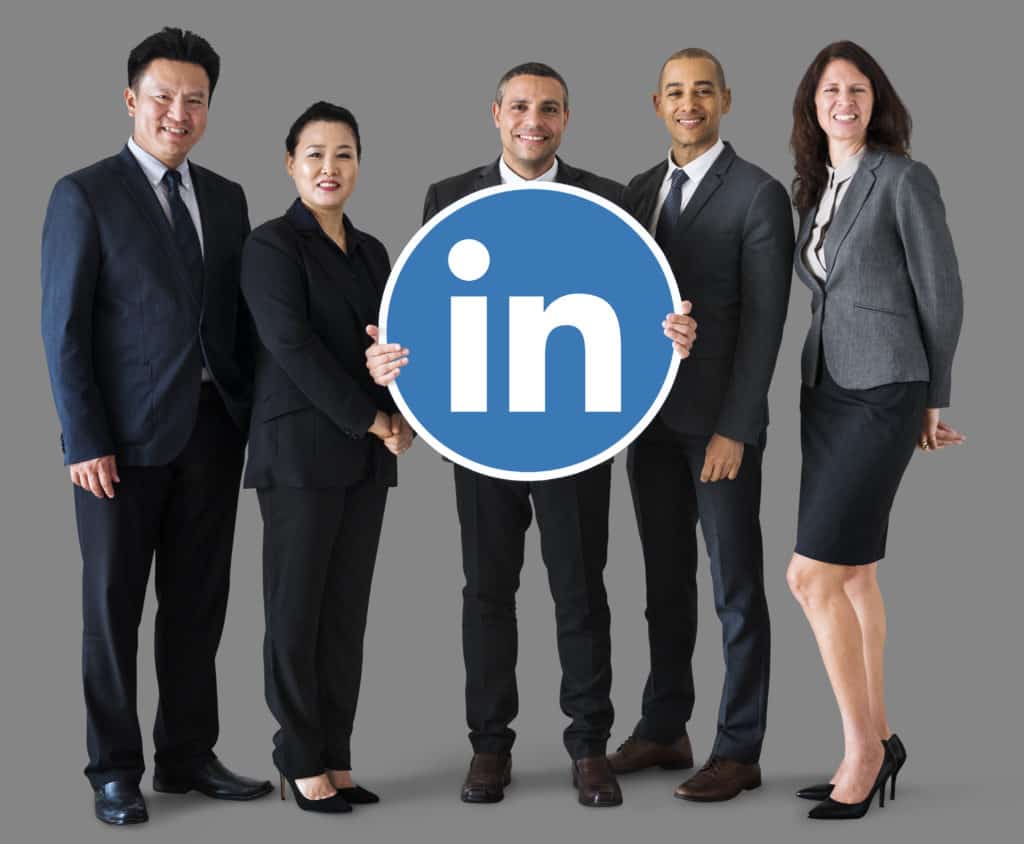business people holding linkedin logo scaled